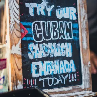 a sign that says try our cuban
