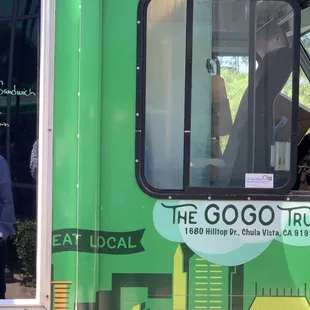 a man standing in front of the truck