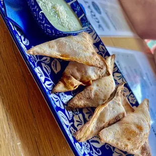 Chicken tinga wontons. The sauce is jalapeño ranch and so good!