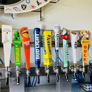 a row of beer taps