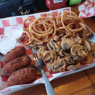 Goat appetizer....crab stuffed jalapenos, onion strings and sliced fried mushrooms