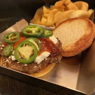Goat cheese hamburger with jam and jalapeños