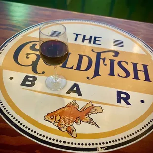 a glass of wine on a table
