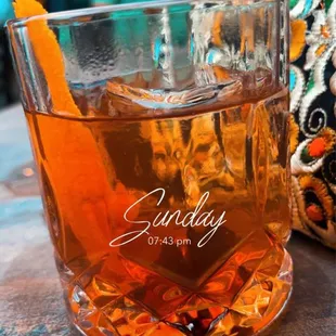 a glass of beverage on a table