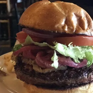 Porchetta-style pulled pork, Colorado-raised Angus patty, pickled onions and brioche bun.