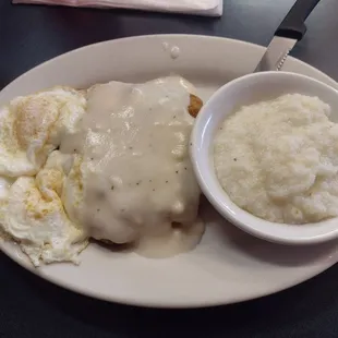Chicken fried steak, eggs, and grits. Came with toast for under $10.