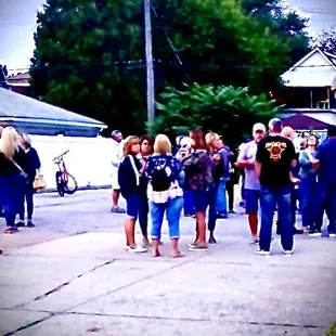 Candid photo of patrons gathering together for the 100th year anniversary