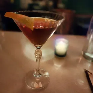 a cocktail in a martini glass