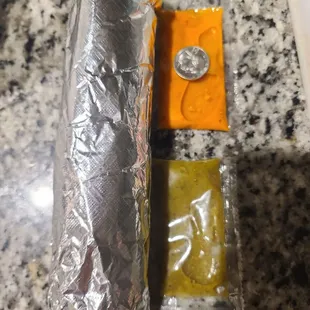 Quarter for scale next to the packet salsa