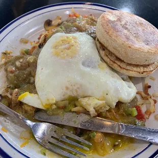 The dude is a mix of fresh Veggies on top of crunchy hash browns, cheese and green chili, topped off with an egg your way! So yum!