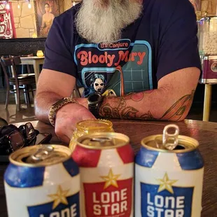 The hubby with our beers..