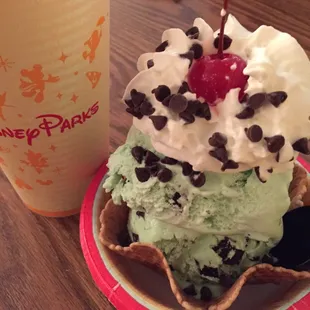 Mint chocolate chip sundae in a waffle cone bowl topped with whipped cream and a marishino (sp) cherry :D A+++