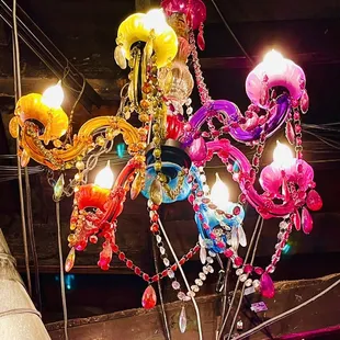 a colorful chandelier hanging from the ceiling