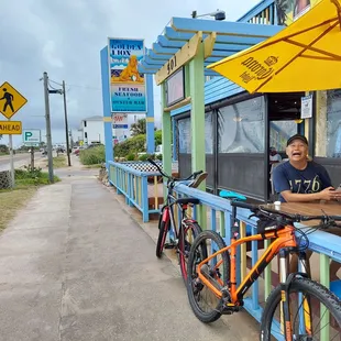 a man sitting at a table with a laptop