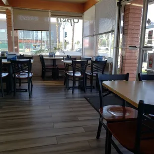 a restaurant with tables and chairs