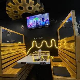 a table with a television in the background