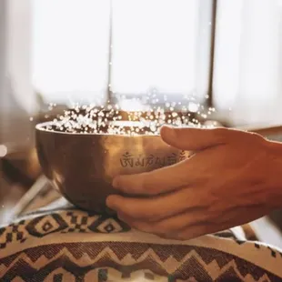 Water in singing bowls for a deep cellular therapy session