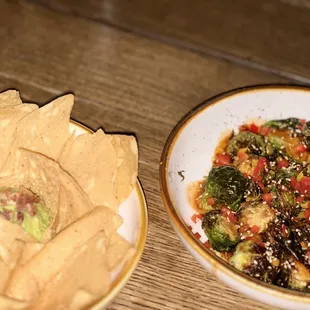 Chips and guacamole and bacon dip. Brussels sprouts in chili lime sauce.