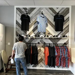 Some of their apparel. Andy Reid's shirts are on the bottom left.