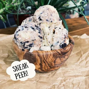 a wooden bowl filled with ice cream