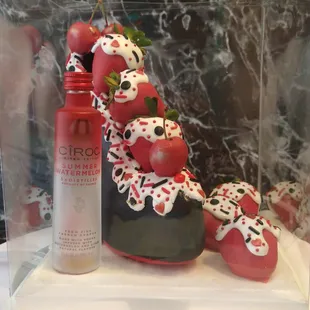 a display of a cake with strawberries
