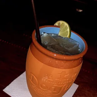 a drink with a lime wedge in it