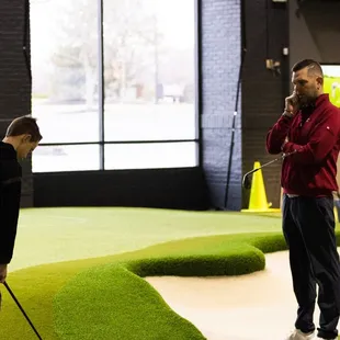 Junior golfer working on short game with Top 50 US Kids Coach, Mack McConaha.