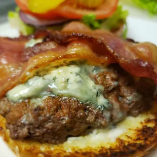 a burger with bacon and blue cheese