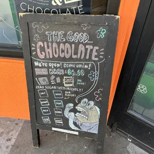 a chalkboard sign outside of a store