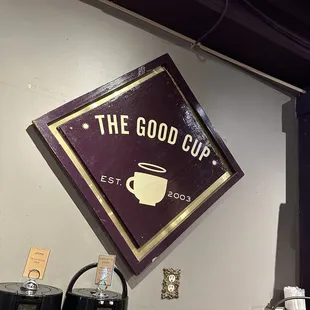 a coffee shop with a sign above it