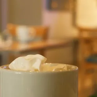 a cup of coffee with whipped cream