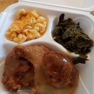 Smothered pork chops, mac, greens.