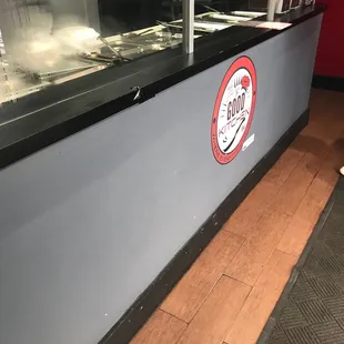 a counter with a sign on it