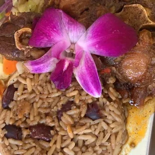 Oxtails, rice and peas, cabbage