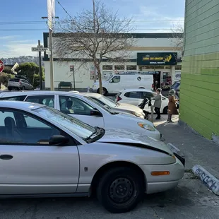 a damaged car in a parking lot