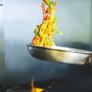 a wok being cooked