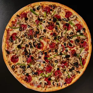 a pizza with pepperoni, mushrooms, and olives