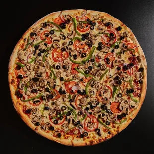 a pizza with mushrooms and peppers