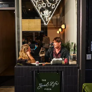 a man and a woman sitting at a table