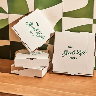 a stack of pizza boxes