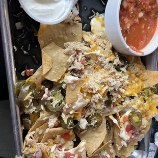 Partially eaten chicken nachos