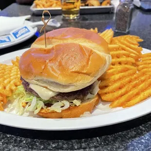 Single patty Blaze burger with waffle fries (buddy's wings and fries in background)