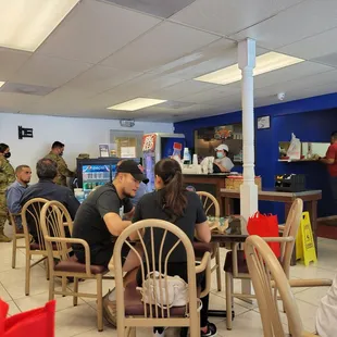 a group of people sitting at a table
