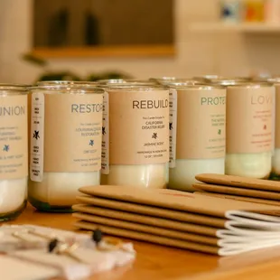Awesome candles - each scent donates to a cause. Hand poured of local beeswax and soy in recycled glass jars.