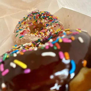 Chocolate sprinkled donut, white sprinkled donut.