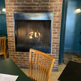 Lovely addition to decor and warmth of restaurant. Does produce heat so don't sit in front of it if you don't like to be warm.