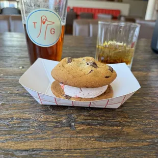 Ice cream sandwich. Chocolate chip cookie strawberry ice cream.