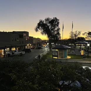 a view of a street at dusk
