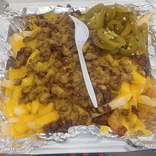 a tray of fries and cheese