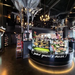 interior view of the pastry case, coffee bar, and to-go item fridge